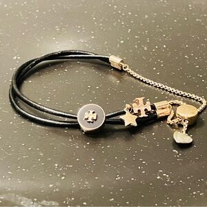 Tory Burch-Kira Double Leather Slider Bracelet in Black and Gold. Shows min wear